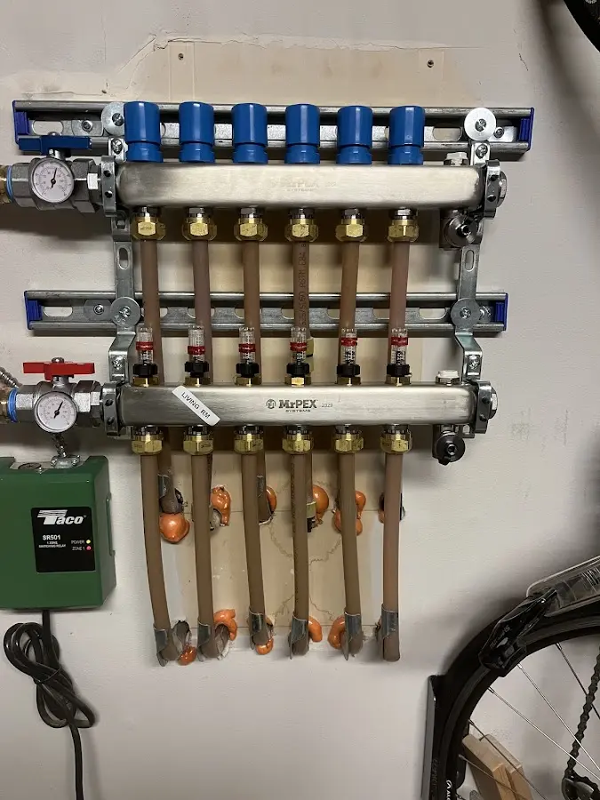 Plumber performing Water Heater Repair at a residential property in Summerfield